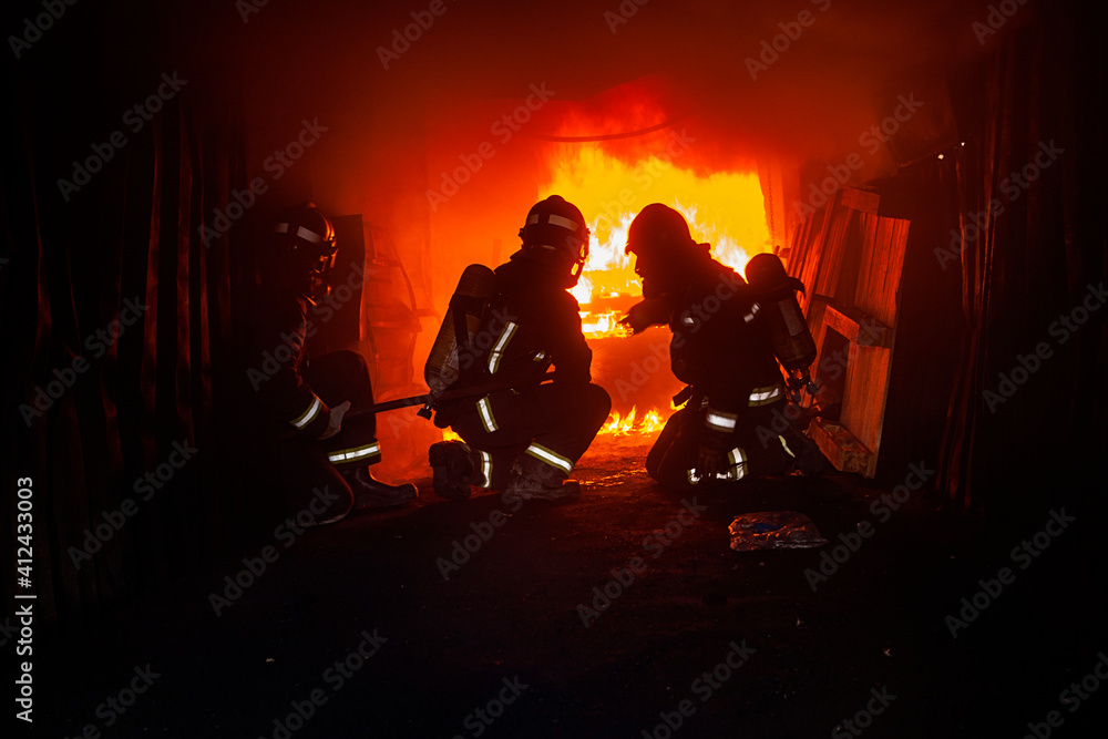 Firemen fighting a fire Firemen fighting a fire