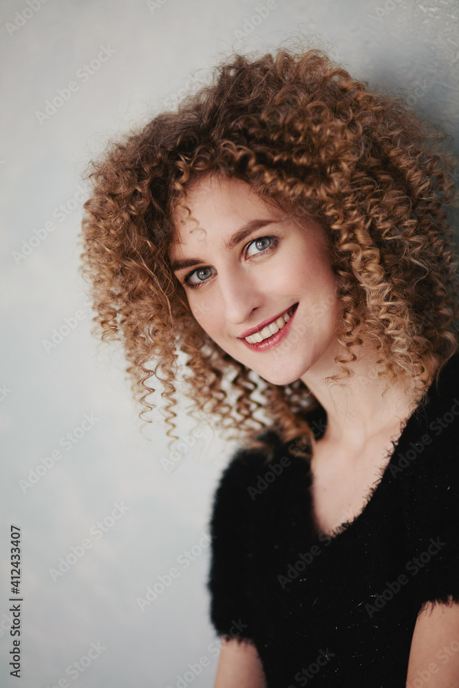 Close up portrait of a young curly blonde Close up portrait of a young curly blonde