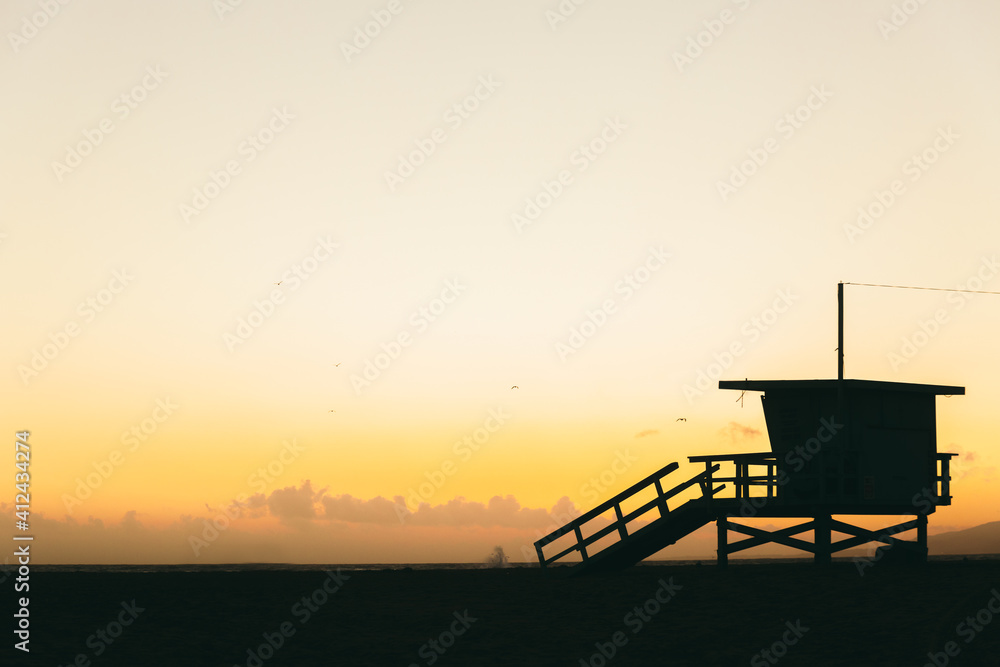 Silhouette of lifeguard cabin at sunset Silhouette of lifeguard cabin at sunset