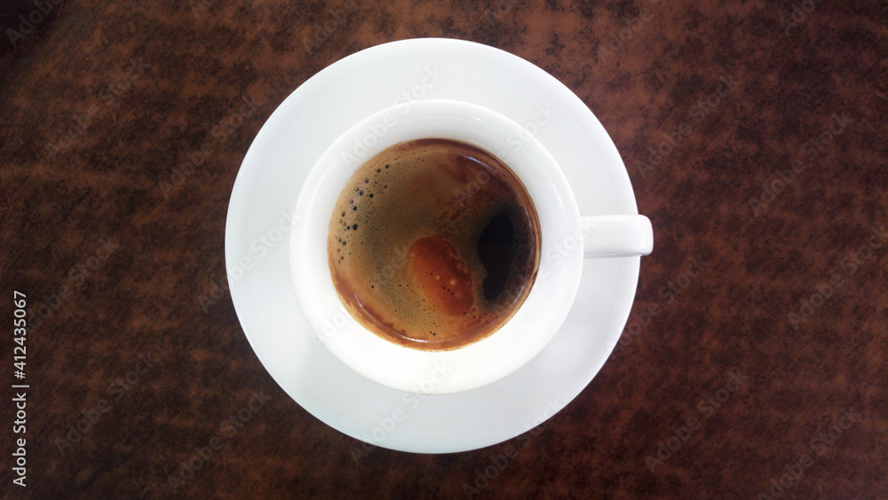 white coffee cup on a brown background white coffee cup on a brown background