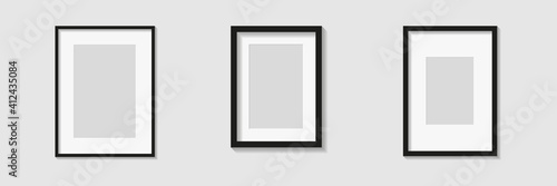 Set of black photo or picture frames with white mat and shades isolated on gray background. Vector illustration. Wall decor. Rectangle vertical photo frames