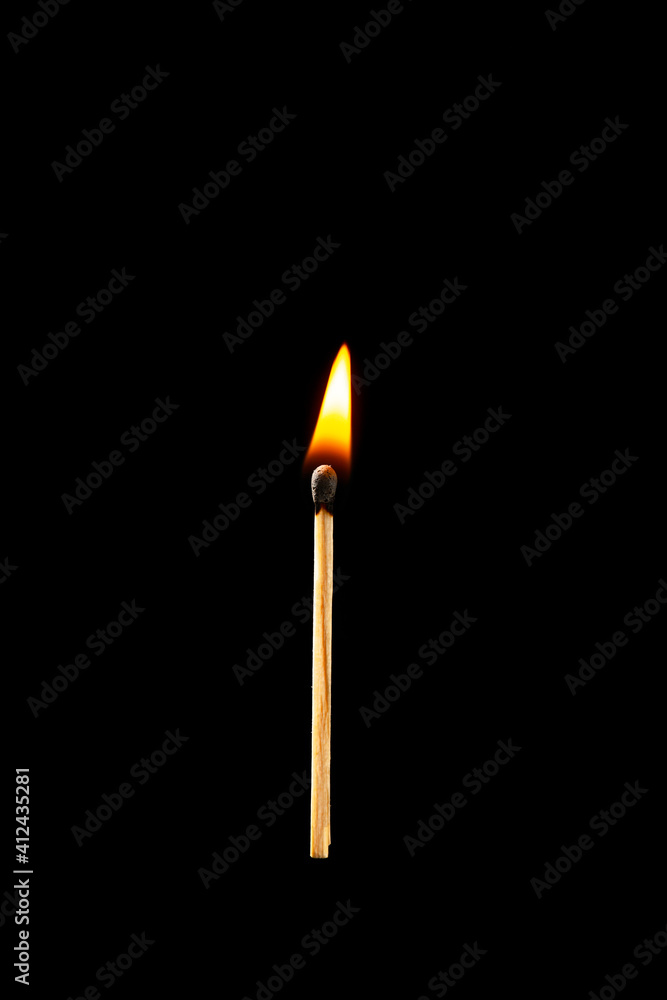 Burning match on dark background Burning match on dark background