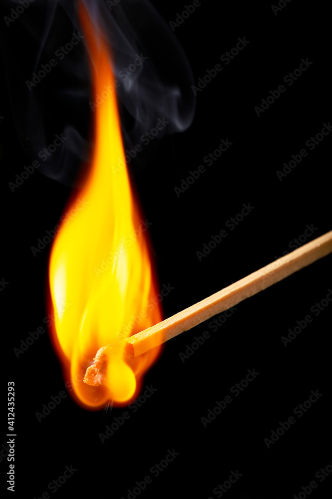 Burning match on dark background, closeup Burning match on dark background, closeup