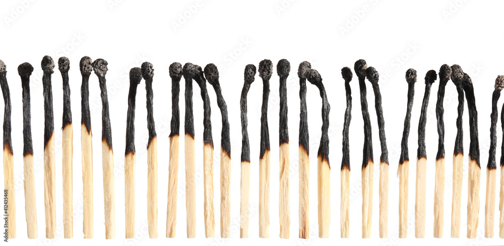 Burnt out matches on white background Burnt out matches on white background