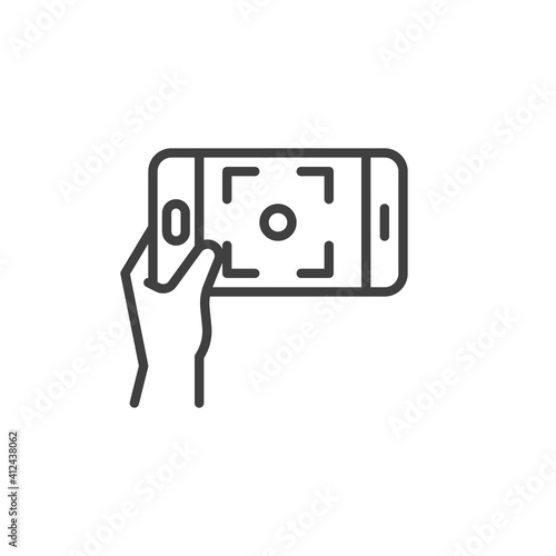 Taking selfie photo line icon. linear style sign for mobile concept and web design. Hand holding phone outline vector icon. Symbol, logo illustration. Vector graphics