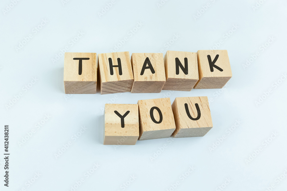 Thank you word made with building blocks on white Thank you word made with building blocks on white