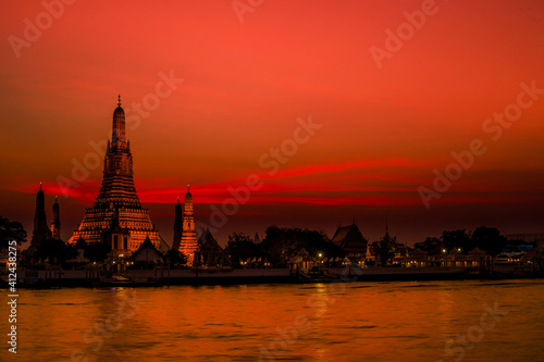 Blurred abstract background of the pagoda scenery of Wat Arun on the Chao Phraya River in Bangkok of Thailand, the silhouette, the light hitting the sculpture, has a kind of artistic beauty