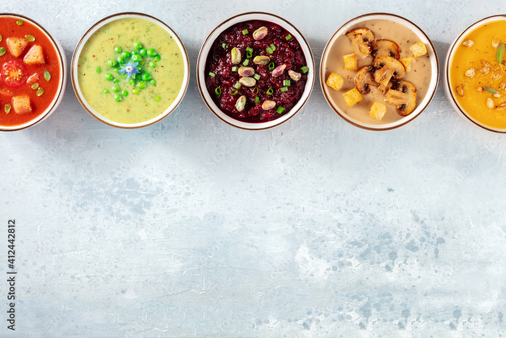 Vegan soups background with a place for text. Various cream soups, shot from above Vegan soups background with a place for text. Various cream soups, shot from above