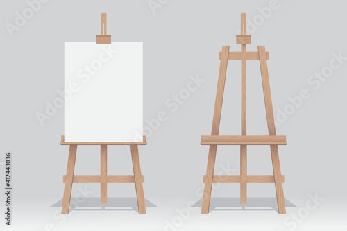 Fotografia Wooden easel stand with blank canvas on white background