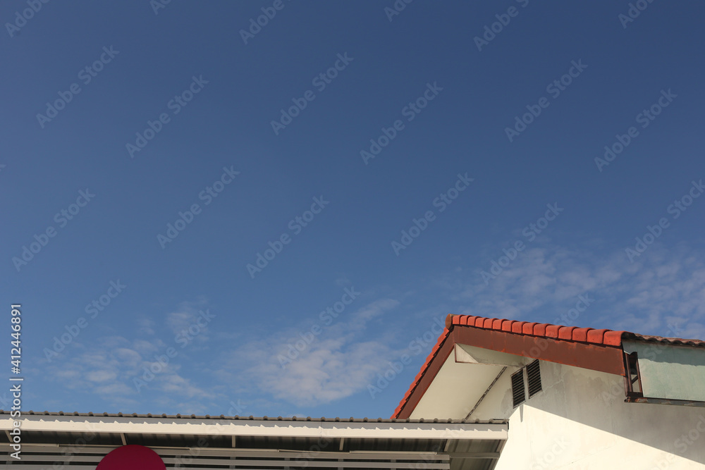 Roof of the house on blue sky background.