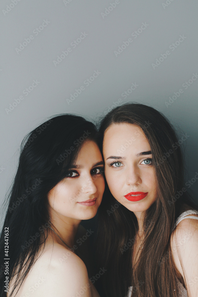 Beautiful young models with bright make-up and long hair