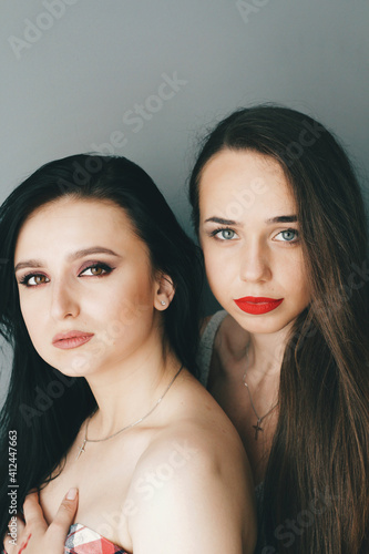 Beautiful young models with bright make-up and long hair