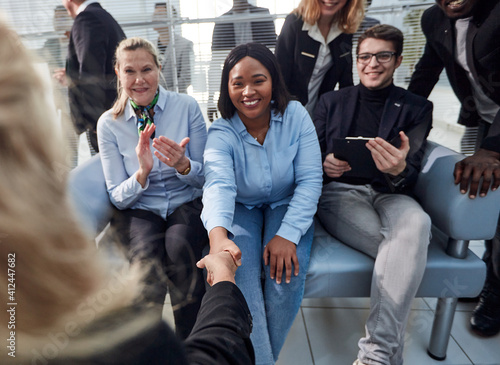 Great job. Successful business team is clapping their hands in modern workstation, celebrating the performance of new product