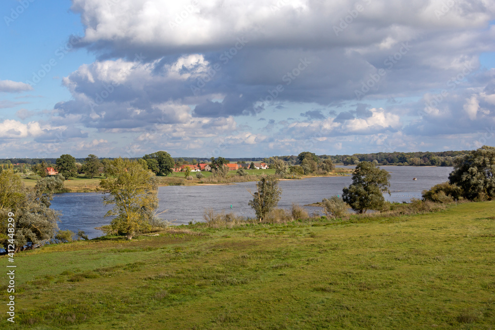 View of a small village directly behind the dyke of the river Elbe.