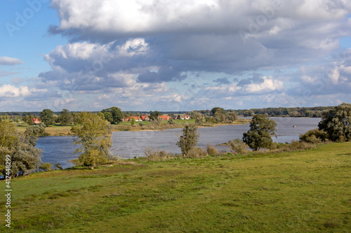 Obraz na płótnie View of a small village directly behind the dyke of the river Elbe. w salonie