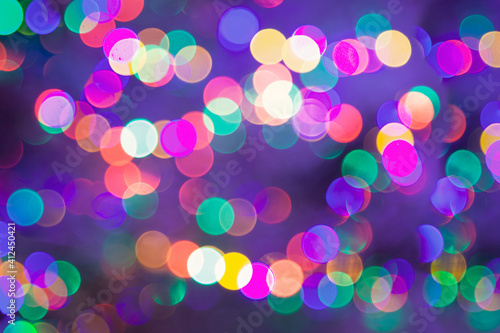 Colorful abstract background, carnival lights in bokeh.Festive blurry background