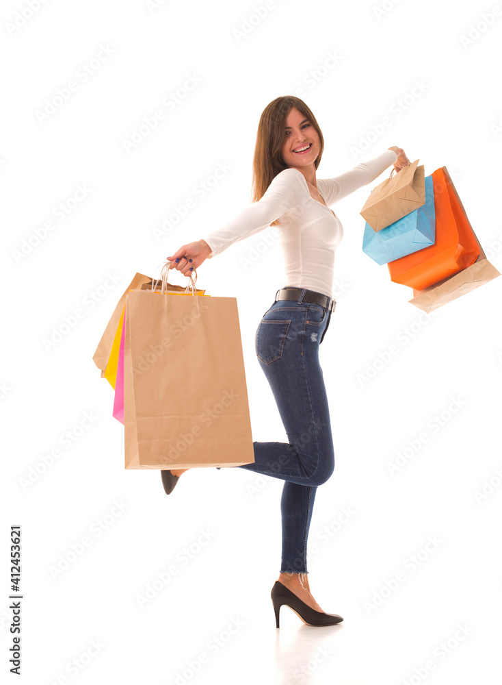 Girl in high heels stands with shopping after sale Girl in high heels stands with shopping after sale