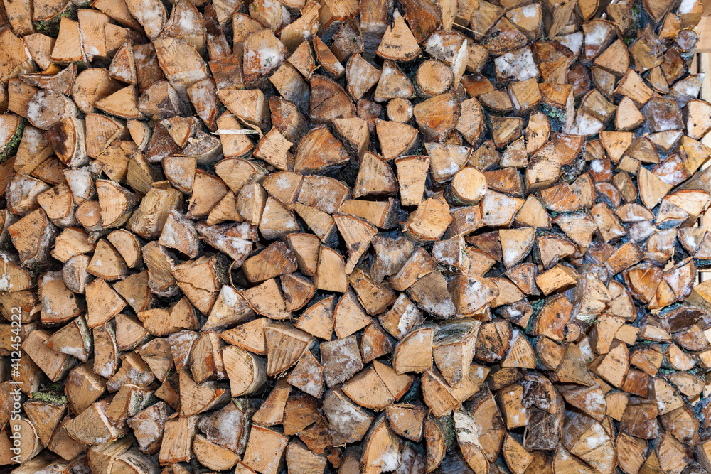 Lots of stacked wood. Prepare for the winter. Firewood background
Lots of stacked wood. Prepare for the winter. Firewood background