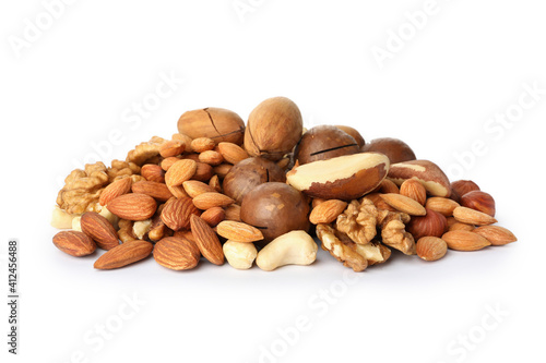Heap of different tasty nuts isolated on white background