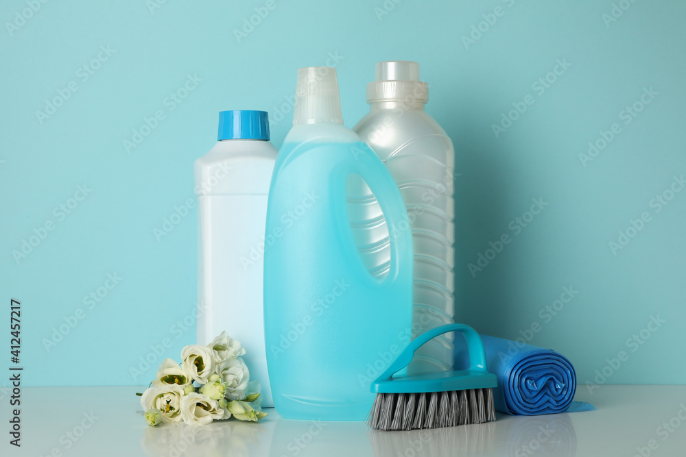 Cleaning tools on blue background, space for text Cleaning tools on blue background, space for text