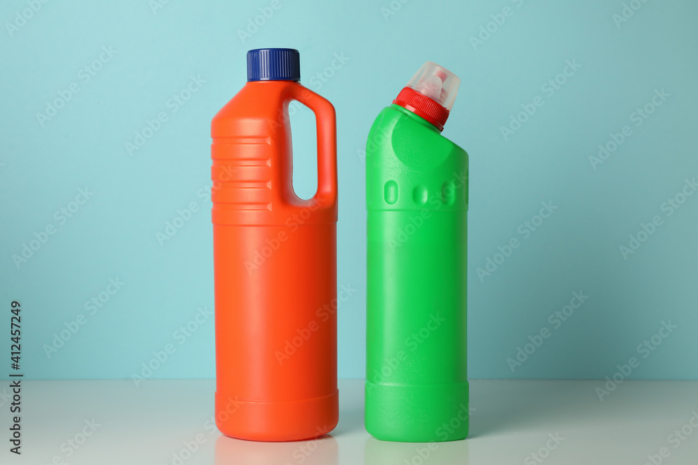 Blank bottles with detergent on blue background Blank bottles with detergent on blue background