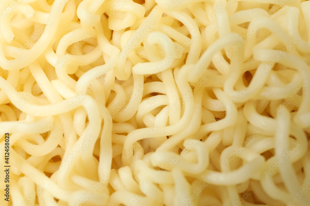 Cooked instant noodles on whole background, macro Cooked instant noodles on whole background, macro