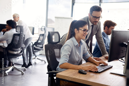 Group of happy multiethnic business people in a meeting at office