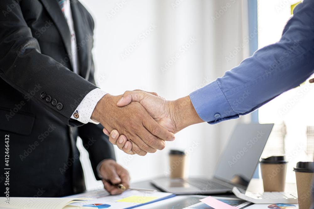 Businessmen Handshaking join to form a startup, Handshaking is a Western greeting or congratulation. Young businessmen form startups and are growing higher. Startup idea.