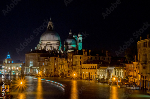 View of the cathedral over the grand canal in venice at night © Agata