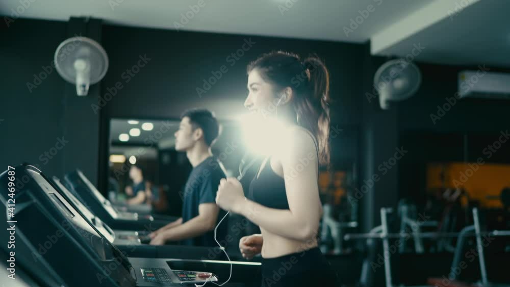 young asian woman walks on a treadmill at the gym. cardio exercises in the gym
young asian woman walks on a treadmill at the gym. cardio exercises in the gym