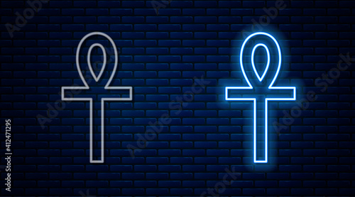 Glowing neon line Cross ankh icon isolated on brick wall background. Vector.