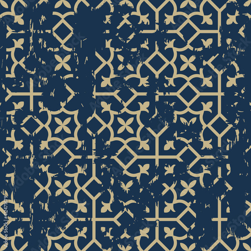 Seamless geometric pattern in oriental style with an effect of attrition. Abstract retro vector texture. Vintage Islamic wallpaper. Lattice graphic design. Vector tiles pattern in gold and dark blue.