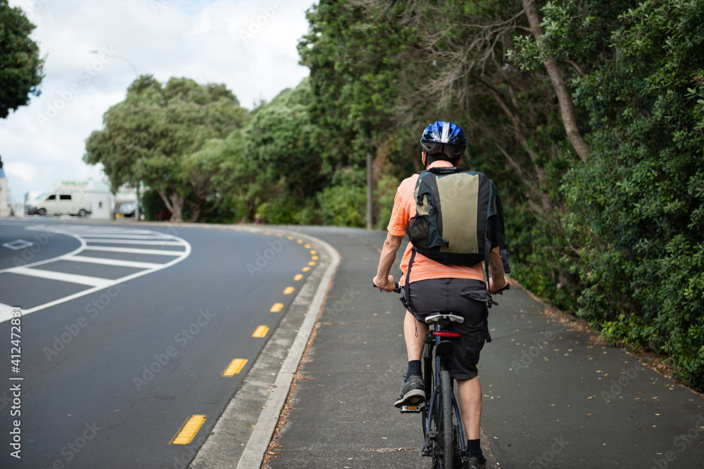 Cycling to work on the cycle lane, North Shore, Auckland