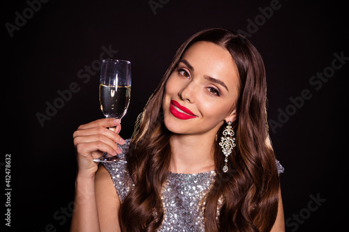 Photo of gorgeous stunning young woman hold champagne glass wear glamour clothes isolated on black color background