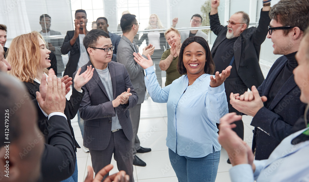 large international business team celebrating their success . large international business team celebrating their success .