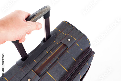 Man holds a suitcase for tr...