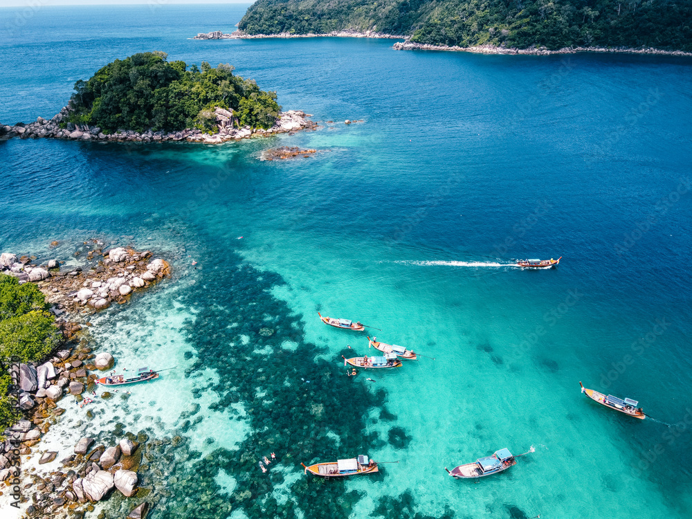 Aerial view of the long tail boats on tropical sea satun, Thailand ,Island and coral