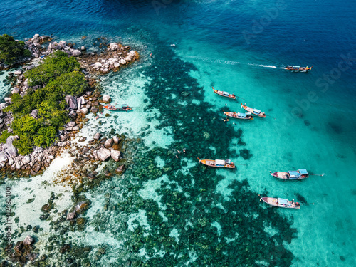 Aerial view of the long tail boats on tropical sea satun, Thailand ,Island and coral