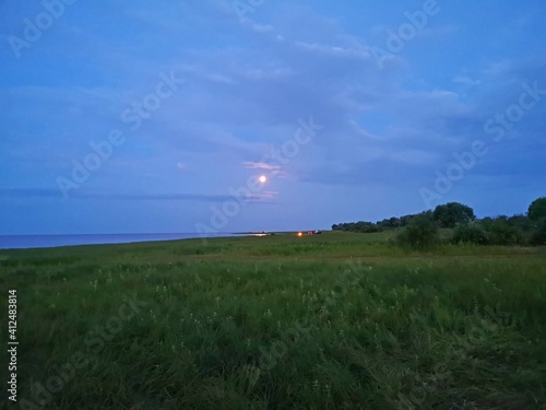 summer moon night over Lake Ilmen Russia