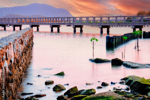 Stone bridge in the middle of the sea Evening Time Beautiful Sunset Sea scape