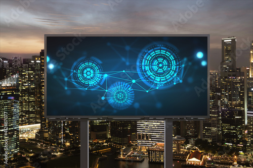 Information flow hologram on road billboard, night panorama city view of Singapore. The largest technological center in Southeast Asia. The concept of programming science.