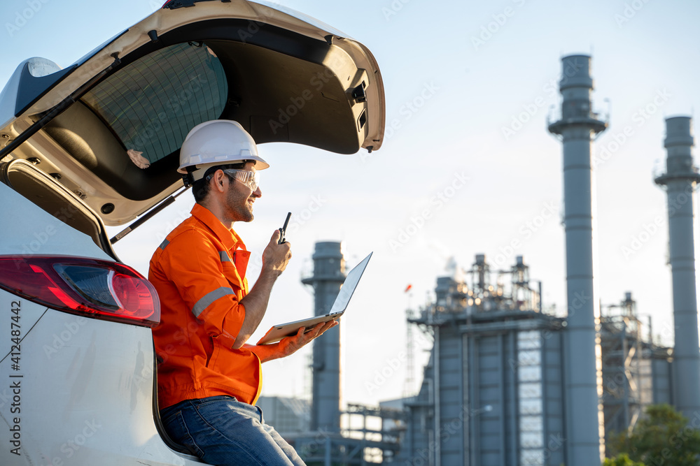 Engineer use radio communication working at refinery industry,Concept to professional engineer on industrial. Engineer use radio communication working at refinery industry,Concept to professional engineer on industrial.