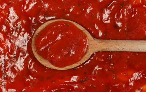 Pastasauce Napoli, pasta sauce with wooden spoon background and texture, top view