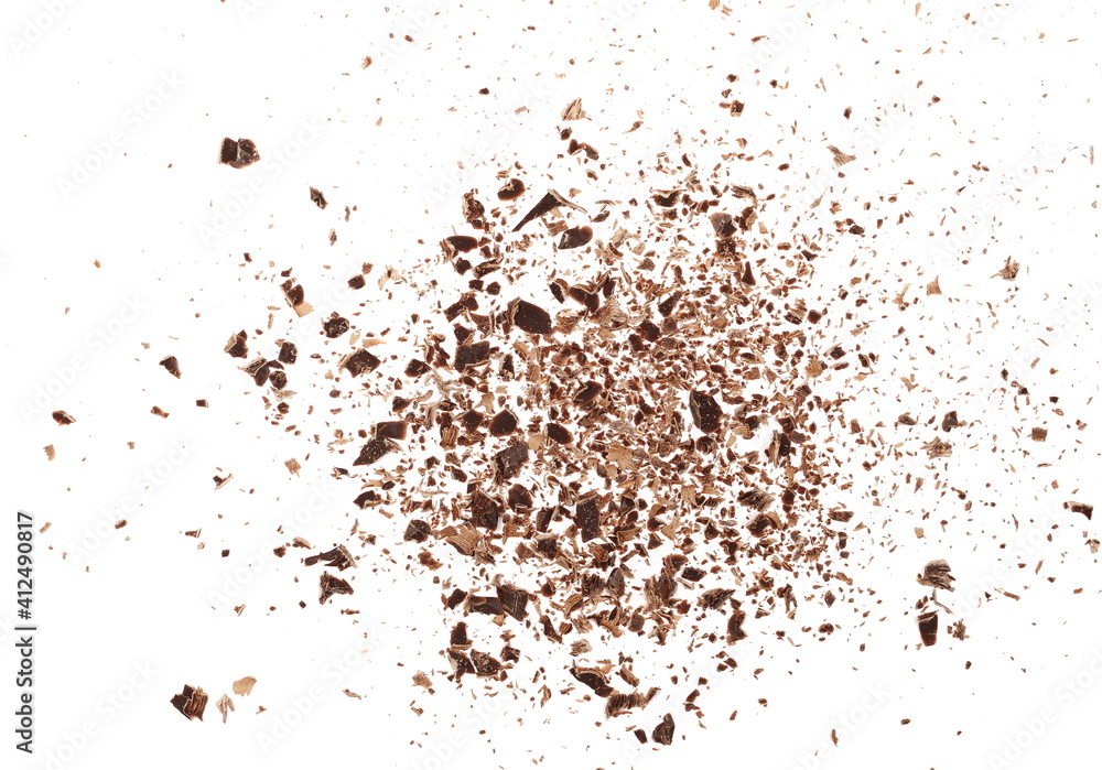 Chocolate shavings, grated flakes pile isolated on white background, top view Chocolate shavings, grated flakes pile isolated on white background, top view