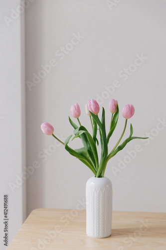 Wallpaper Mural Pink tulips in a white vintage vase in a European Scandinavian styled interior. Torontodigital.ca