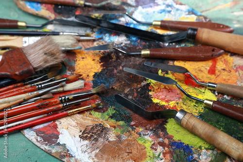 brushes, paints and palette, all for creativity