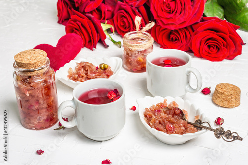 Tea time with rose petals jam and hot beverage