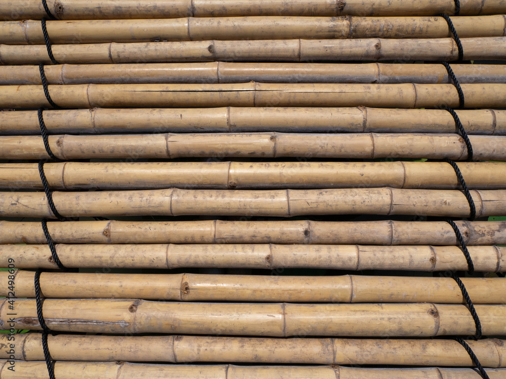 old brown tone bamboo mat or bamboo plank fence texture for background old brown tone bamboo mat or bamboo plank fence texture for background