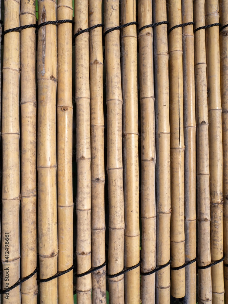 Naklejka premium old brown tone bamboo mat or bamboo plank fence texture for background