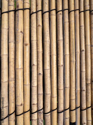 Fototapeta Naklejka Na Ścianę i Meble -  old brown tone bamboo mat or bamboo plank fence texture for background